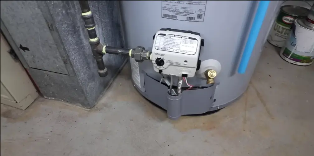 Gas water heater burner control and relief valve at the base of the tank